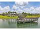 Beautiful pond view of the fishing pier, community pool, and surrounding greenery at 5079 Royal Point Ave, Kissimmee, FL 34746