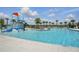 Community swimming pool with water park features and ample seating for residents at 5079 Royal Point Ave, Kissimmee, FL 34746