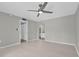 The bedroom has a ceiling fan, neutral walls, flooring, and a doorway to the bathroom at 514 Orange Dr # 31, Altamonte Springs, FL 32701