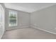 A spacious bedroom features neutral walls, flooring, and a bright window with blinds at 514 Orange Dr # 31, Altamonte Springs, FL 32701