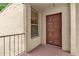 Exterior view of the front door to the residence with a window and security railing at 514 Orange Dr # 31, Altamonte Springs, FL 32701