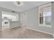 Open floor plan with eat-in counter between living area and white kitchen with matching appliances at 514 Orange Dr # 31, Altamonte Springs, FL 32701