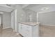 Kitchen area with white cabinetry, stone countertops, and an open floor plan for seamless flow at 514 Orange Dr # 31, Altamonte Springs, FL 32701