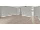 Bright, vacant living room with tile flooring leading to additional rooms in the house at 514 Orange Dr # 31, Altamonte Springs, FL 32701