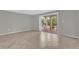 Spacious living room with neutral paint, light tile floor, and access to the outdoor balcony at 514 Orange Dr # 31, Altamonte Springs, FL 32701