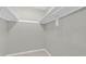 Walk-in closet featuring ample shelving and neutral-colored walls providing great storage at 514 Orange Dr # 31, Altamonte Springs, FL 32701