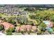 Stunning aerial view of a community with a lake, lush greenery, and well-maintained buildings at 5168 Conroy Rd # 35, Orlando, FL 32811