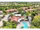 Overhead view of the community with pool, clubhouse, tennis court, and lush surroundings at 5168 Conroy Rd # 35, Orlando, FL 32811