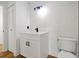 Bathroom with white vanity, black faucet and hardware, and a sliding door closet at 5168 Conroy Rd # 35, Orlando, FL 32811
