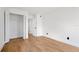 A bedroom with light wood floors and a closet with double doors at 5168 Conroy Rd # 35, Orlando, FL 32811