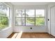 Bedroom with large windows overlooking a scenic lake and lush greenery at 5168 Conroy Rd # 35, Orlando, FL 32811
