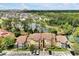 Waterfront condominium complex featuring brick and siding accents and mature trees offering beautiful curb appeal at 5168 Conroy Rd # 35, Orlando, FL 32811