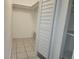 Organized closet with shelving and bi-fold doors, providing ample storage space at 53 W Marbrisa Way, Kissimmee, FL 34743