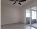 Cozy enclosed patio with tile floors, screens, and sliding glass door at 53 W Marbrisa Way, Kissimmee, FL 34743