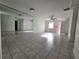 Bright living room with large mirror and neutral tile flooring at 53 W Marbrisa Way, Kissimmee, FL 34743