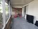 Spacious screened-in patio with wood wall and sliding door access at 53 W Marbrisa Way, Kissimmee, FL 34743