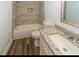 Well-lit bathroom with a tiled shower and modern vanity at 5311 Ansonia Ct, Orlando, FL 32839