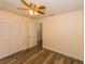 Large bedroom with closet, ceiling fan, and luxury vinyl flooring at 5311 Ansonia Ct, Orlando, FL 32839