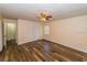 Large bedroom with closet, ceiling fan, and luxury vinyl flooring at 5311 Ansonia Ct, Orlando, FL 32839