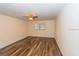 An empty bedroom featuring hardwood flooring and neutral colored walls at 5311 Ansonia Ct, Orlando, FL 32839