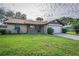 Charming home with a well-maintained front yard, attached garage, and traditional design at 5311 Ansonia Ct, Orlando, FL 32839