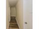 Hallway with doors and wood floors and neutral colored walls at 5311 Ansonia Ct, Orlando, FL 32839