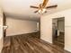 Spacious living room featuring modern hardwood floors, brick fireplace and ample natural light at 5311 Ansonia Ct, Orlando, FL 32839