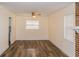 Living room with vinyl flooring and brick fireplace at 5311 Ansonia Ct, Orlando, FL 32839