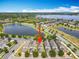 Aerial view of the neighborhood and home's location with waterfront views of the pond at 5772 Laurel Cherry Ave, Winter Garden, FL 34787