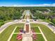Stunning aerial view of the community entrance with manicured landscaping and beautiful tower at 5772 Laurel Cherry Ave, Winter Garden, FL 34787