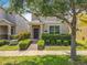 Inviting two-story home featuring manicured hedges and a walkway to the front door at 5772 Laurel Cherry Ave, Winter Garden, FL 34787