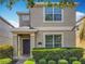 Charming two-story home with well-maintained landscaping and inviting front entrance at 5772 Laurel Cherry Ave, Winter Garden, FL 34787