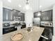 Well-lit kitchen with stainless steel appliances and granite countertops, perfect for cooking at 5772 Laurel Cherry Ave, Winter Garden, FL 34787