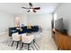 Comfortable living room featuring a ceiling fan and contemporary furniture arrangement on tile flooring at 5772 Laurel Cherry Ave, Winter Garden, FL 34787