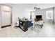 Bright living room with tile flooring, a ceiling fan, and lots of natural light from the large windows at 5772 Laurel Cherry Ave, Winter Garden, FL 34787