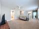 Loft featuring carpet flooring, ceiling fan and view to two different rooms at 5772 Laurel Cherry Ave, Winter Garden, FL 34787