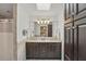 Bathroom showcasing a double vanity with granite countertops and a tiled shower with glass door at 628 Riverpark Cir, Longwood, FL 32779