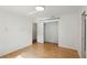 A bedroom with wood floors and a closet, providing a simple and functional space at 628 Riverpark Cir, Longwood, FL 32779
