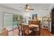 Elegant dining area with pool views, perfect for entertaining guests and enjoying Gathering meals at 628 Riverpark Cir, Longwood, FL 32779