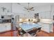 Modern kitchen featuring stainless steel appliances, granite countertops and island seating at 628 Riverpark Cir, Longwood, FL 32779