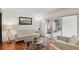 Bright living room with comfortable seating and direct access to an outdoor patio area at 628 Riverpark Cir, Longwood, FL 32779