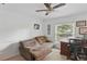 Office with a ceiling fan, hardwood desk, and couch at 628 Riverpark Cir, Longwood, FL 32779