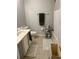 Standard bathroom featuring a tub and shower combination, toilet, sink, and tiled flooring at 6450 Alcalde Ct # 106, Orlando, FL 32835
