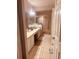 Spacious bathroom with double sinks, tile floors, and glass-enclosed shower stall at 6450 Alcalde Ct # 106, Orlando, FL 32835