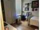 Sunlit bedroom with a large window, closet, and minimalist decor, creating a serene space at 6450 Alcalde Ct # 106, Orlando, FL 32835