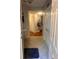 Inviting hallway leading to various rooms, featuring tile flooring and a glimpse of natural light at 6450 Alcalde Ct # 106, Orlando, FL 32835