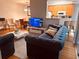 Comfortable living room and dining area with hardwood floors, updated furnishings, and plenty of sunlight at 6450 Alcalde Ct # 106, Orlando, FL 32835