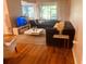 Comfortable living room featuring plush sofas, a white coffee table, and stylish decor at 6450 Alcalde Ct # 106, Orlando, FL 32835