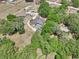 Property aerial showcasing homes with pools, surrounded by mature trees and landscaping, highlighting privacy at 6686 Se 135Th St, Summerfield, FL 34491