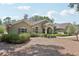 Attractive one-story home featuring well-maintained landscaping and a welcoming entrance, showcasing charm at 6686 Se 135Th St, Summerfield, FL 34491
